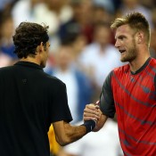 Sam Groth (R) shakes hands with Roger Federer after falling to the Swiss in the second round of the US Open; Getty Images