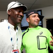 Marinko Matosevic (R) poses with basketball legend Michael Jordan following his first round loss to Roger Federer at the US Open; Getty Images