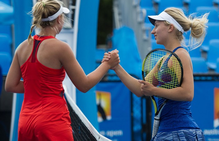 Daria Gavrilova (R) shakes hands with Abbie Myers after winning their Australian Open 2015 Play-off quarterfinal; Elizabeth Xue Bai