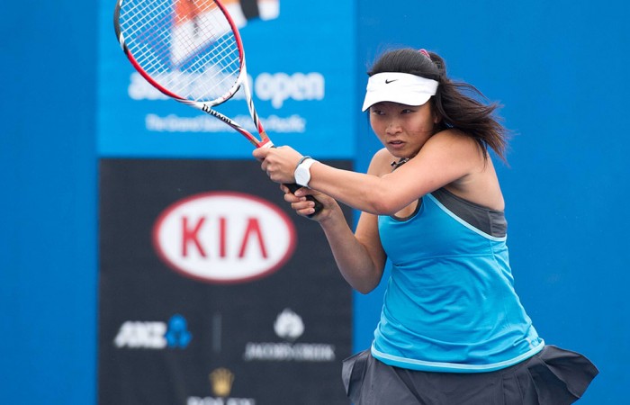 Jeanette Lin in action during her first round win at the 14/u Australian Championships at Melbourne Park; Elizabeth Xue Bai