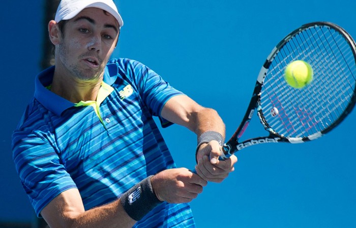 Jordan Thompson in action during his first round win at the Australian Open 2015 Play-off; Elizabeth Xue Bai