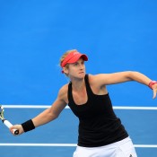 Jessica Moore plays a forehand/backhand in his/her qualifying match against Fiona Ferro during qualifying for 2015 Australian Open at Melbourne Park on January 15, 2015 in Melbourne, Australia.