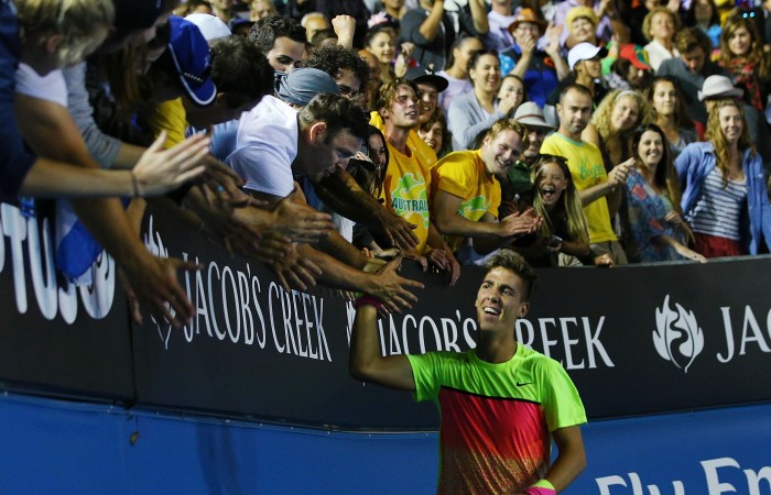 MELBOURNE, AUSTRALIA - JANUARY 19: Thanasi Kokkinakis of Australia celebrates with fans after winning in his first round match against Ernests Gulbis of Latvia during day one of the 2015 Australian Open at Melbourne Park on January 19, 2015 in Melbourne, Australia. (Photo by Michael Dodge/Getty Images)
