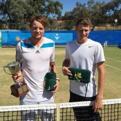 Matthew Barton (L) poses with his trophy after defeating Harry Bourchier (R) in the men's singles final of the Mildura Grand International