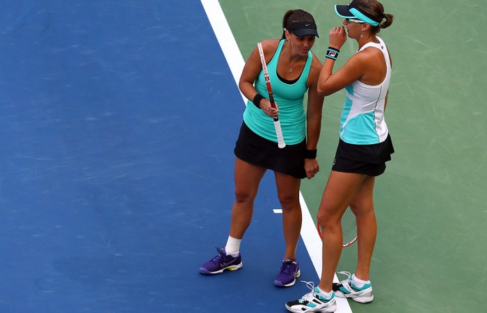 Casey Dellacqua (L) and Yaroslava Shvedova in action during the US Open women's doubles final; Getty Images