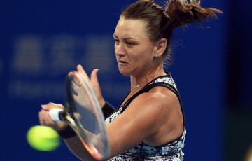 Casey Dellacqua plays a forehand in her first-round loss to Ana Ivanovic at the China Open in Beijing; Getty Images
