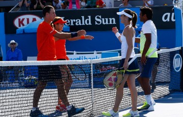 Sam Thompson and Masa Jovanovic (L) shake hands with Martina Hingis and Leander Paes after their first-round mixed doubles match at Australian Open 2015