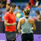 Darren Cahill works with Simona Halep during a training session at the WTA Finals in Singapore, 2015; Getty Images