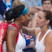Jarmila Wolfe (R) consoles Serena Williams after the world No.1 was forced to withdraw from their Hopman Cup singles match; Getty Images