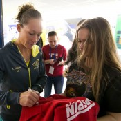 Sam Stosur signs autographs for fans at the Australia v Slovakia Fed Cup tie in Bratislava; Roman Benicky