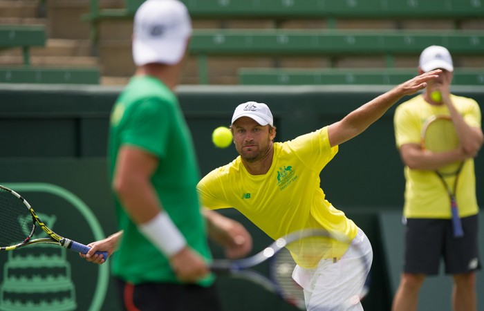 Hitting partner Matt Reid in action as Lleyton Hewitt watches on; Elizabeth Xue Bai