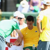 Bernard Tomic gets treatment on his wrist during the reverse singles rubber of the Australia v United States Davis Cup World Group tie at Kooyong; Getty Images