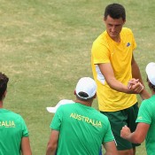 Bernard Tomic is congratulated by teammates after beating Jack Sock in the second singles rubber of the Australia v United States Davis Cup tie at Kooyong Lawn Tennis Club; Getty Images