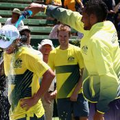 Nick Kyrgios gives Rusty a Powerade shower. Photo: Getty Images