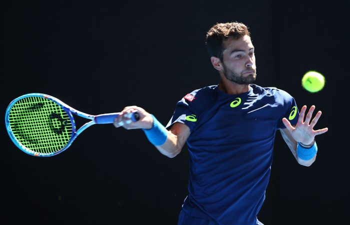 MELBOURNE, AUSTRALIA - JANUARY 18:  Noah Rubin of the United States plays a forehand in his second round match against Roger Federer of Switzerland on day three of the 2017 Australian Open at Melbourne Park on January 18, 2017 in Melbourne, Australia.  (Photo by Michael Dodge/Getty Images)