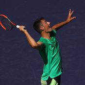 Bernard Tomic serves during his first-round loss to Bjorn Fratangelo at the 2017 BNP Paribas Open; Getty Images