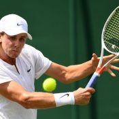 LONDON, ENGLAND - JULY 10:  Blake Ellis of Australia plays a backhand during the Boy's Singles first round match against Trent Bryde of the United States on day seven of the Wimbledon Lawn Tennis Championships at the All England Lawn Tennis and Croquet Club on July 10, 2017 in London, England.  (Photo by Shaun Botterill/Getty Images)