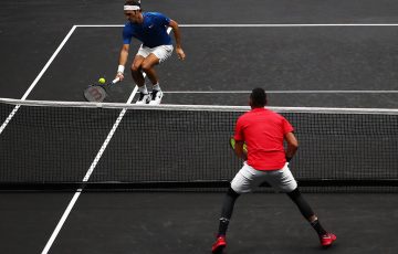 Roger Federer (top) and Nick Kyrgios do battle in their singles match at the  Laver Cup in Prague; Getty Images