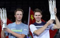 John Peers (R) and Henri Kontinen hoist their Shanghai Masters champions' trophies; Getty Images
