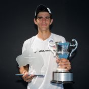 Alexander Crnokrak poses with his trophies after beating Benard Nkomba in the final of the 18/u Australian Championships at Melbourne Park; Elizabeth Xue Bai