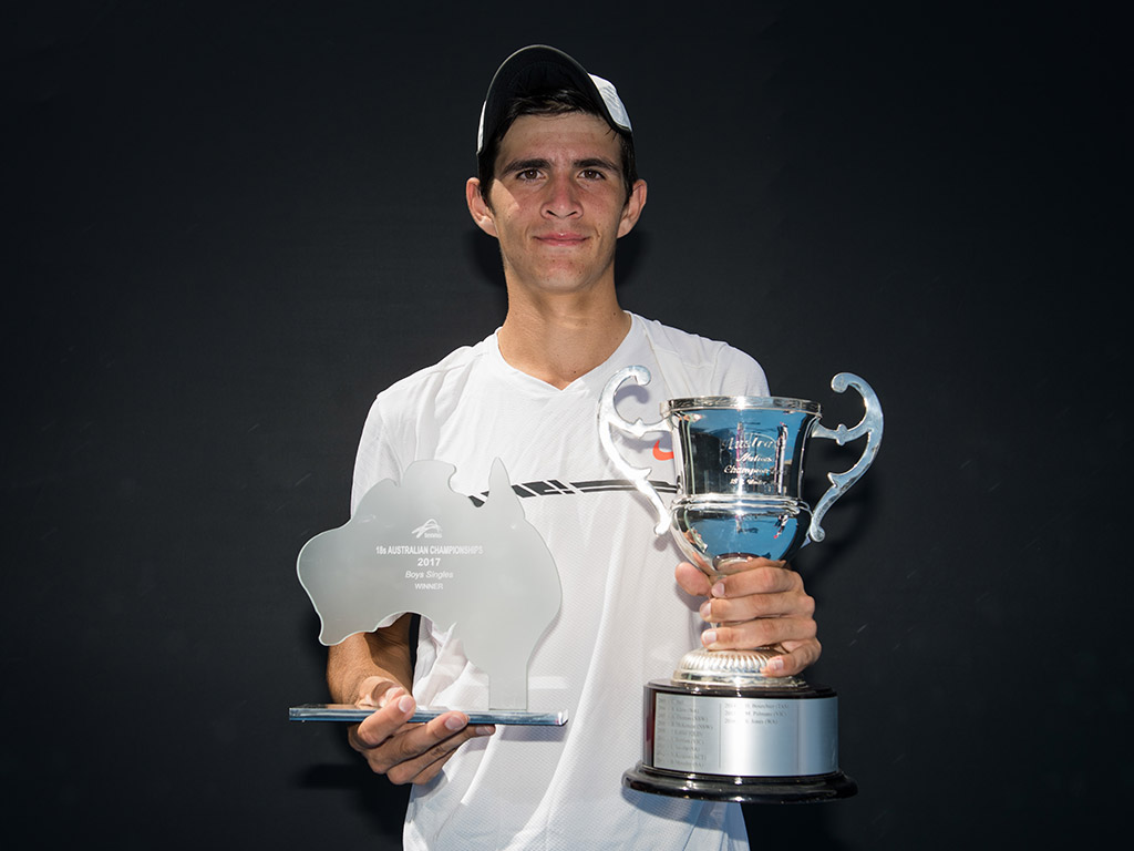 Alexander Crnokrak poses with his trophies after beating Benard Nkomba in the final of the 18/u Australian Championships at Melbourne Park; Elizabeth Xue Bai
