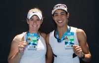 Belinda Woolcock (L) and Astra Sharma pose with their Australian Open player accreditations after winning the women's doubles AO Play-off event at Melbourne Park (photo credit Elizabeth Xue Bai)