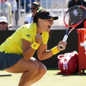 Casey Dellacqua celebrates her doubles victory with Ash Barty to hand Australia a 3-2 victory over Ukraine in the Fed Cup World Group II first round in February 2018; Getty Images