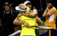 Destanee Aiava (R) and Daria Gavrilova celebrate their victory in the doubles rubber to give Australia a 4-1 victory over Netherlands in the fed Cup World Group Play-off tie in Wollongong; Getty Images