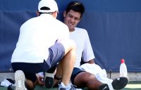 Jason Kubler receives is attended to by a physio after rolling his ankle during the third set of his second-round loss to Taylor Fritz at the US Open; Getty Images