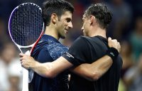 Novak Djokovic (L) embraces John Millman after beating the Australian in the US Open quarterfinals; Getty Images