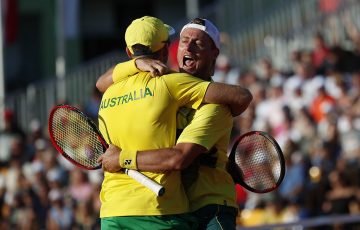 Lleyton Hewitt (R) and John Peers celebrate victory against Oliver Marach and Jurgen Melzer in Australia's Davis Cup World Group Play-off tie against Austria in Graz; Getty Images