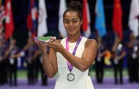 Annerly Poulos poses with her trophy after finishing runner-up in the U16 WTA Future Stars event in Singapore; Getty Images