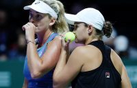 Ashleigh Barty (R) and CoCo Vandeweghe discuss tactics during their WTA FInals semifinal loss to Timea Babos and Kristina Mladenovic; Getty Images