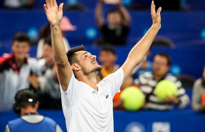 Bernard Tomic celebrates his victory at the ATP tournament in Chengdu, China; Getty Images