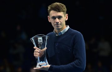 Alex De Minaur poses with his ATP Newcomer of the Year award on court at the ATP Finals in London; Getty Images