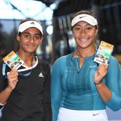 Naiktha Bains (L) and Destanee Aiava pose with their Australian Open player accreditations after winning the doubles final at the AO Play-off (photo: Elizabeth Xue Bai)