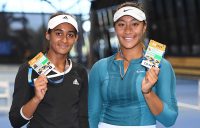 Naiktha Bains (L) and Destanee Aiava pose with their Australian Open player accreditations after winning the doubles final at the AO Play-off (photo: Elizabeth Xue Bai)