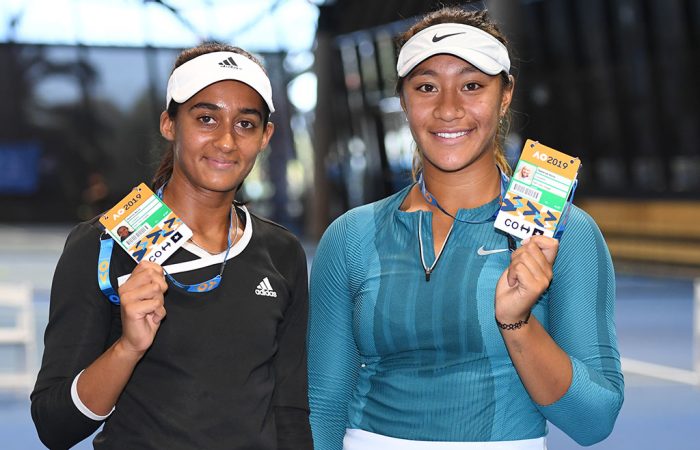 Naiktha Bains (L) and Destanee Aiava pose with their Australian Open player accreditations after winning the doubles final at the AO Play-off (photo: Elizabeth Xue Bai)