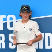 Charlie Camus poses with his trophy after winning the 12/u Australian singles title (photo: Elizabeth Xue Bai)