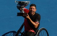 Dylan Alcott hoists the Australian Open 2018 champion's trophy; Getty Images