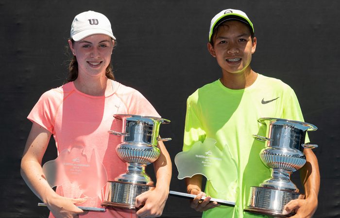 Talia Gibson (L) and Derek Pham pose with their trophies after winning the 14/u Australian titles at Melbourne Park (photo: Elizabeth Xue Bai)