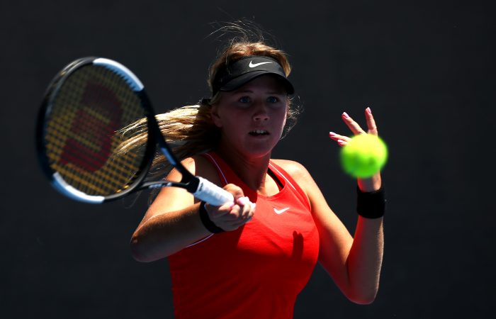 MELBOURNE, AUSTRALIA - JANUARY 19:  Amber Marshall of Australia plays a forehand in her first round Junior Girls' Singles match against Mana Kawamura of Japan during day six of the 2019 Australian Open at Melbourne Park on January 19, 2019 in Melbourne, Australia.  (Photo by Mike Owen/Getty Images)