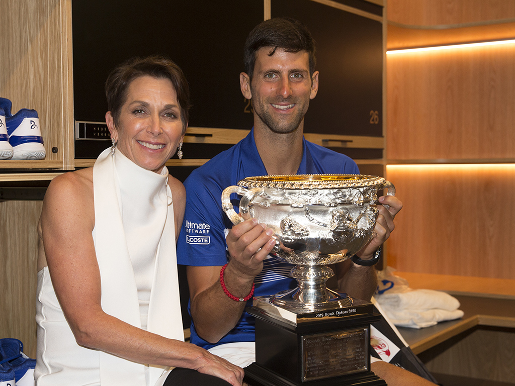 Jayne Hrdlicka poses with Australian Open 2019 men's singles champion Novak Djokovic (Fiona Hamilton/Tennis Australia)