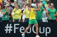 Ash Barty celebrates with the Australian bench after winning her reverse singles rubber against Aryna Sabalenka in Brisbane (Getty Images)