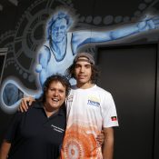 DARWIN, AUSTRALIA - AUGUST 29: Evonne Goolagong Cawley and Zachary Scott stand in front of a mural of Evonne painted by a group of local artists, including David Collins and Indigenous artists Shaun Lee ‘Hafleg’ and Jesse Bell to celebrate and recognise her incredible achievements during the National Indigenous Tennis Carnival at the Darwin International Tennis Centre on August 29, 2019 in Darwin, Australia. (Photo by Darrian Traynor/Getty Images)