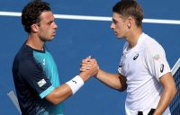 Alex de Minaur (R) won his first-round match over Marco Cecchinato at the Cincinnati Masters (Getty Images)