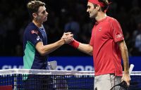Swiss Roger Federer (R) shakes hands to Australian Alex De Minaur after winning at the Swiss Indoors tennis tournament in Basel on October 27, 2019. (Photo by FABRICE COFFRINI / AFP) (Photo by FABRICE COFFRINI/AFP via Getty Images)