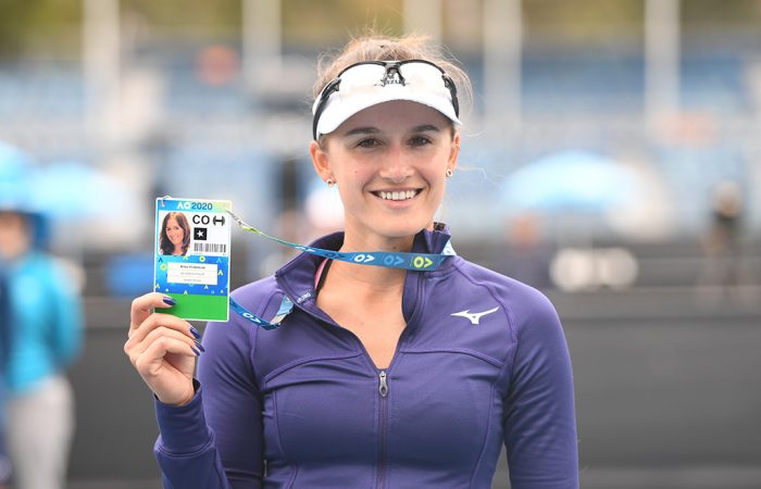 Arina Rodionova celebrates her victory at the AO Play-off with her player accreditation pass for Australian Open 2020. (photo: Elizabeth Bai/Tennis Australia)