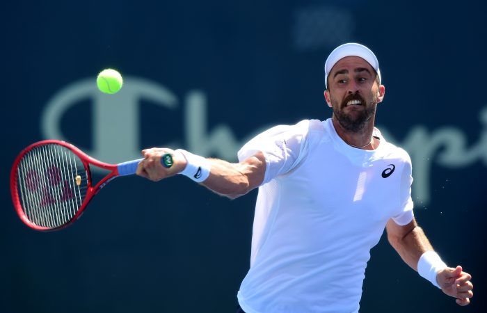 WINSTON SALEM, NORTH CAROLINA - AUGUST 23: Steve Johnson returns a shot from John Millman of Australia during their quarterfinals match on day seven of the Winston-Salem Open at Wake Forest University on August 23, 2019 in Winston Salem, North Carolina. (Photo by Jared C. Tilton/Getty Images)