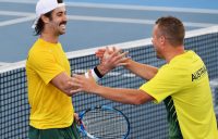 FIRED UP: Jordan Thompson celebrates his Davis Cup victory against Brazil's Thiago Monteiro with Aussie captain Lleyton Hewitt. Picture: Getty Images